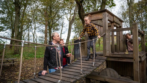 A family enjoying the Delaval Playdium in autumn at Seaton Delaval Hall Northumberland